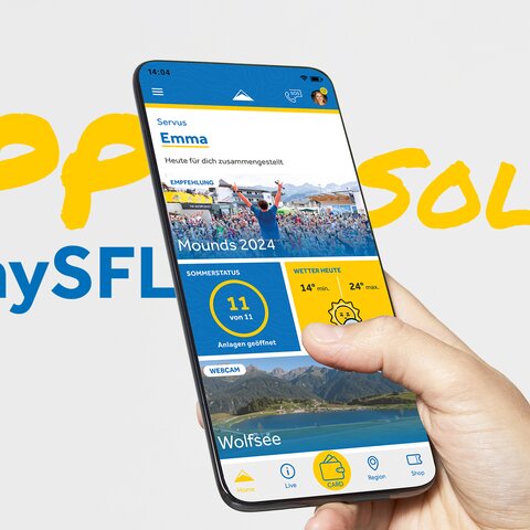 Smartphone mit geöffneter mySFL-App in einer Hand, die aktuelle Informationen zu Wetter, geöffnete Anlagen und Events in Serfaus-Fiss-Ladis anzeigt | © Serfaus-Fiss-Ladis Marketing GmbH