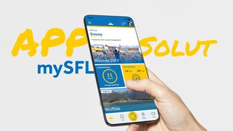 Smartphone mit geöffneter mySFL-App in einer Hand, die aktuelle Informationen zu Wetter, geöffnete Anlagen und Events in Serfaus-Fiss-Ladis anzeigt | © Serfaus-Fiss-Ladis Marketing GmbH