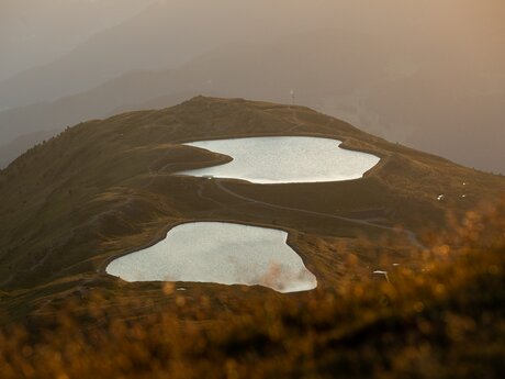 Frommes Speicherseen Sonnenaufgang am Berg Serfaus-Fiss-Ladis in Tirol | © Serfaus-Fiss-Ladis Marketing GmbH | Andreas Kirschner